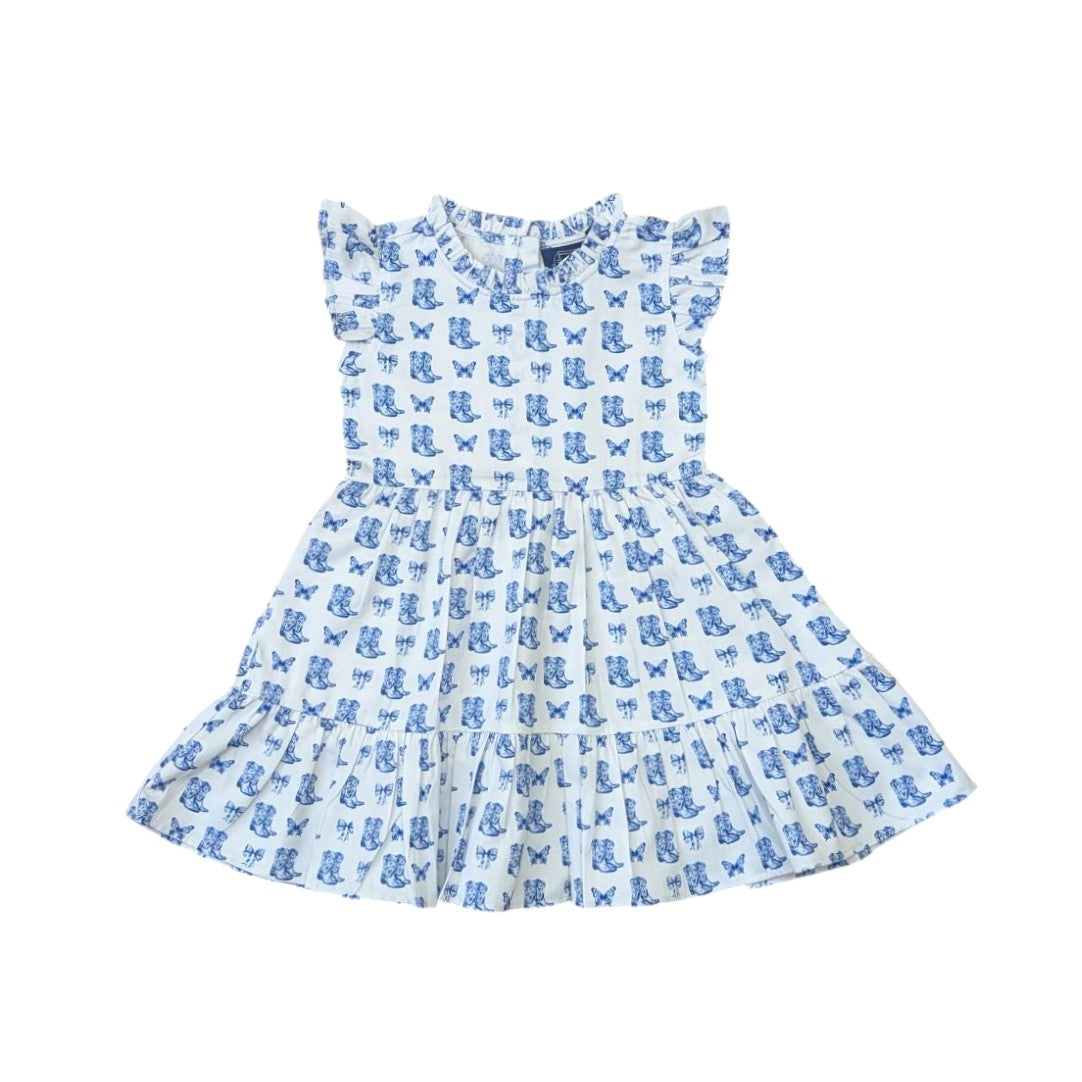 White dress with blue butterfly and boots in a toile pattern on a white background