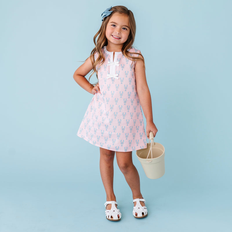 Young girl in a pink lobster dress 