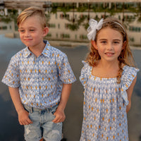 TukTuk Designs classic goldfish print in a breezy flutter sleeve dress is perfect for the summers. It is made with 100% soft viscose and perfect for twirling. Also available in matching sibling shirt.