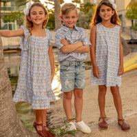 TukTuk Designs classic goldfish print in a breezy flutter sleeve dress is perfect for the summers. It is made with 100% soft viscose and perfect for twirling. Also available in matching sibling shirt.