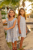 TukTuk Designs Goldfish shift dress features classic fish print with contrasting trim detail. Made with 100% cotton, this nautical dress is sure to be a summer staple. Available in matching sibling shirt!