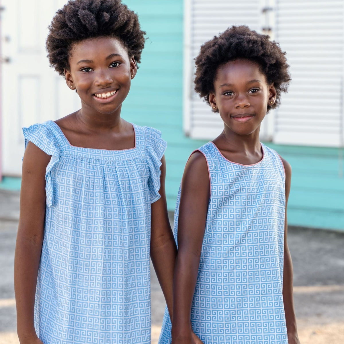 TukTuk Designs Greek Key print in blue dress is a staple for the summer. The flutter sleeve dress is made of 100% soft viscose and totally twirl worthy! Also available in matching sibling shirt. 