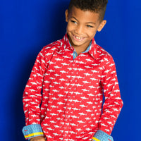 TukTuk Designs Boys shirts in a fun red mako shark print, designed to spark the imagination of little minds. Thoughtfully tailored in small batches and with fine detailing for stylish little gentlemen. Perfect for beach vacations, holidays, parties and memorable moments for the shark-obsessed! Available in matching girls dress.