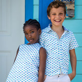 TukTuk Designs Origami Sailboat print with delicate blue and green sailboats available in girls dresses and matching boys shirts.