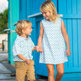 TukTuk Designs Origami Sailboat print with delicate blue and green sailboats available in girls dresses and matching boys shirts.