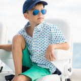 TukTuk Designs short sleeve button up boys shirt in nautical origami sailboat print in blue and green with contrast chambray trim on collar and placket. Available in matching sibling girls dresses. 