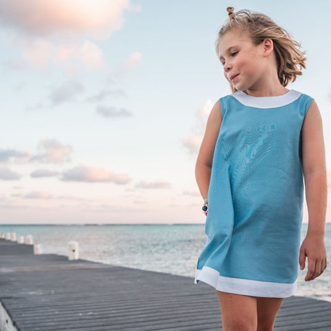 TukTuk Designs girls classic shift dress in ocean blue with white trims and side pockets. Perfect for the beach, play dates and everyday.