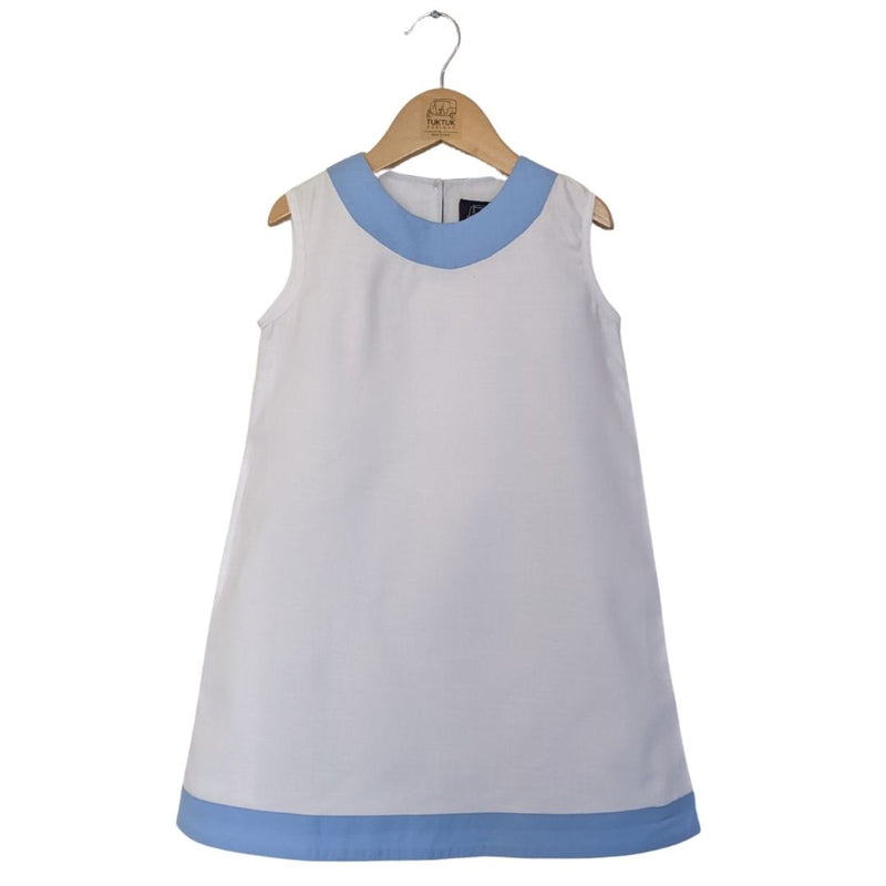 TukTuk Designs girls classic shift dress in cool white with blue trims and side pockets. Perfect for the beach, play dates and everyday.