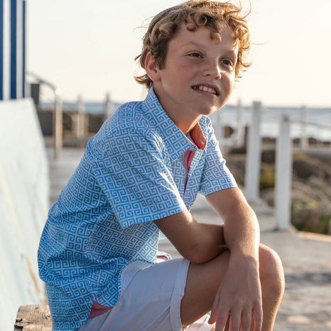 TukTuk Designs Greek Key print in blue is a staple for the summer. The shirt is made with 100% cotton and features contrasting details on the collar and placket. Also available in matching sibling dress. 