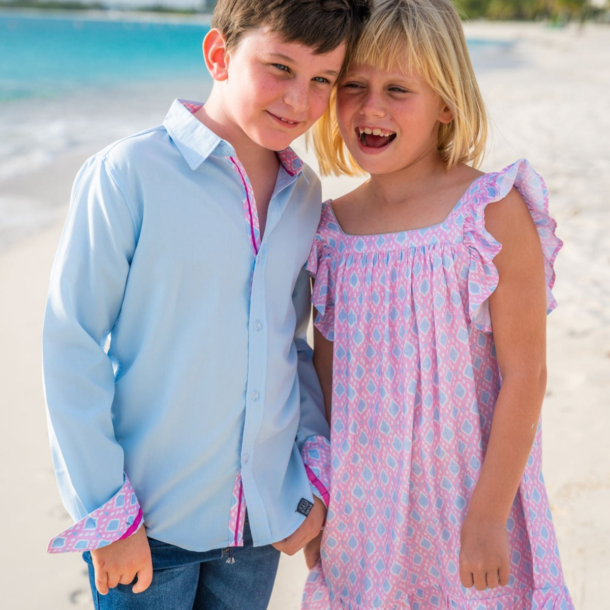Beautiful pink Ikat print Flutter sleeves dress in soft viscose. Perfect for spring and available in matching sibling shirt and daddy and me shirt.