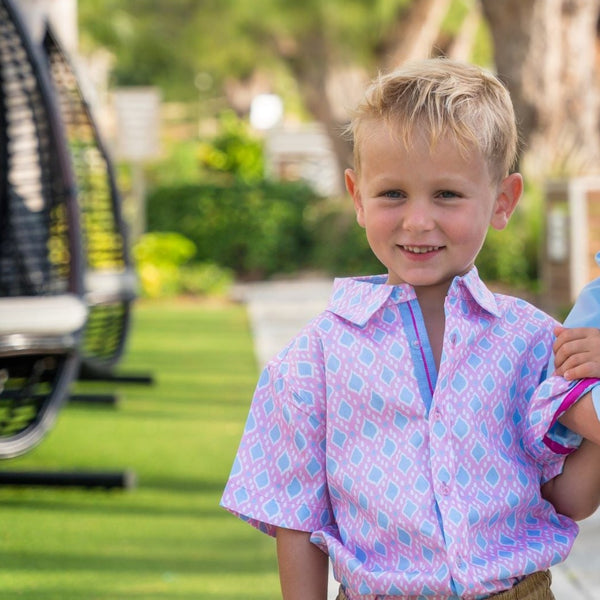 TukTuk Designs Ikat in Pink print is the perfect shirt for Easter brunch, vacations or any spring day. Made with 100% cotton and features details on the collar and placket. Also available to pair with matching sibling dresses and daddy and me shirt.