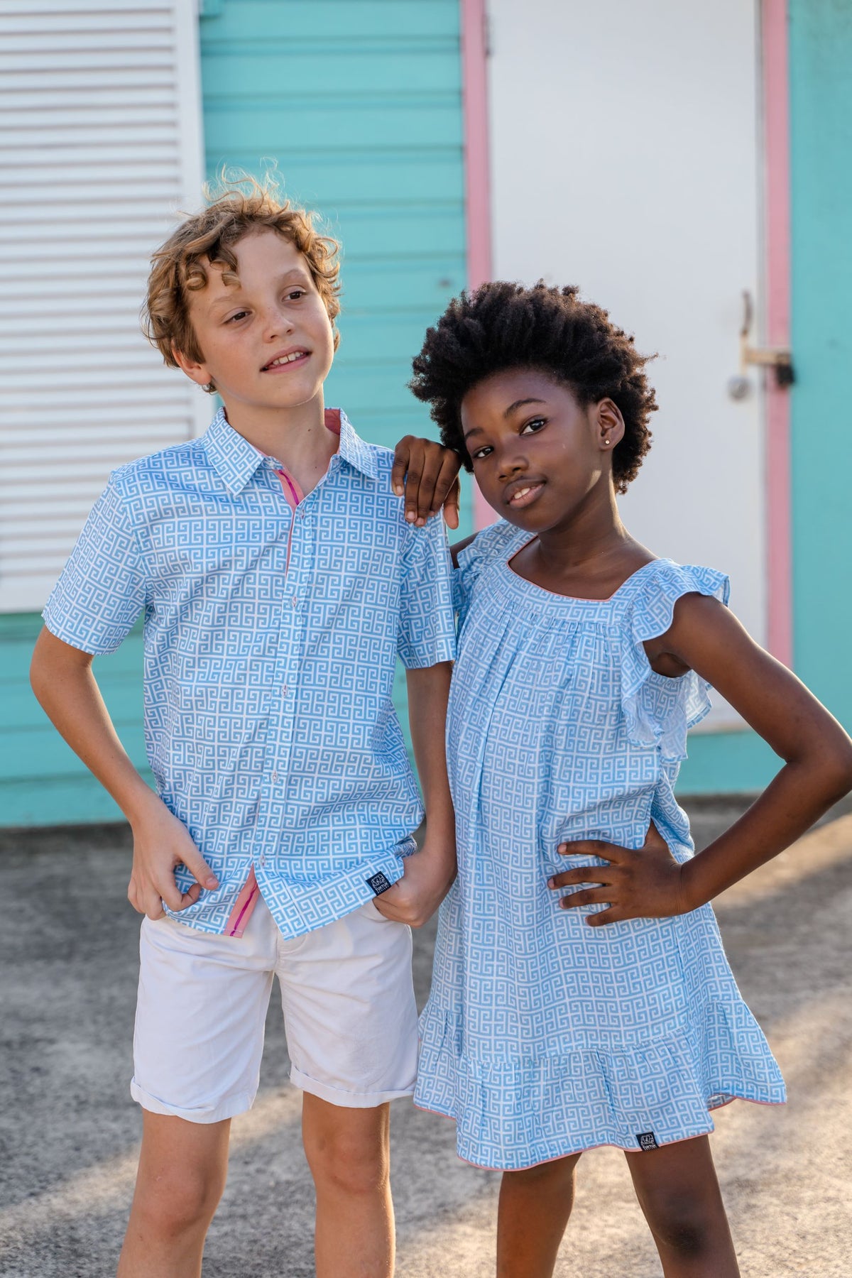 TukTuk Designs Greek Key print in blue dress is a staple for the summer. The flutter sleeve dress is made of 100% soft viscose and totally twirl worthy! Also available in matching sibling shirt. 