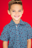 TukTuk Designs short sleeve blue nautical shirt in sailboat print with contrast collar, cuff and placket. Available in matching daddy and me size.