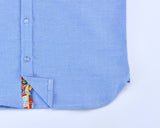 TukTuk Designs long sleeve boys button up chambray, denim blue shirt with colorful contrast trim detail.