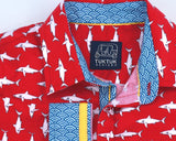 TukTuk Designs Boys shirts in a fun red mako shark print, designed to spark the imagination of little minds. Thoughtfully tailored in small batches and with fine detailing for stylish little gentlemen. Perfect for beach vacations, holidays, parties and memorable moments for the shark-obsessed! Available in matching girls dress.